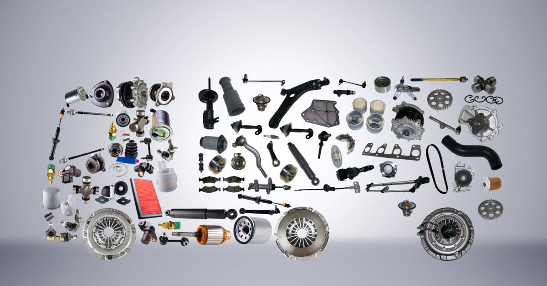 A collection of vehicle parts arranged in the shape of a truck and trailer on a plain gray background.